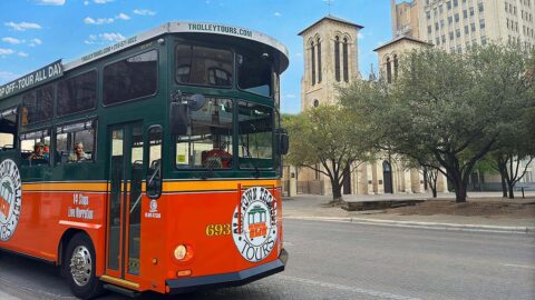 San Antonio trolley driving past San Fernando Cathedral