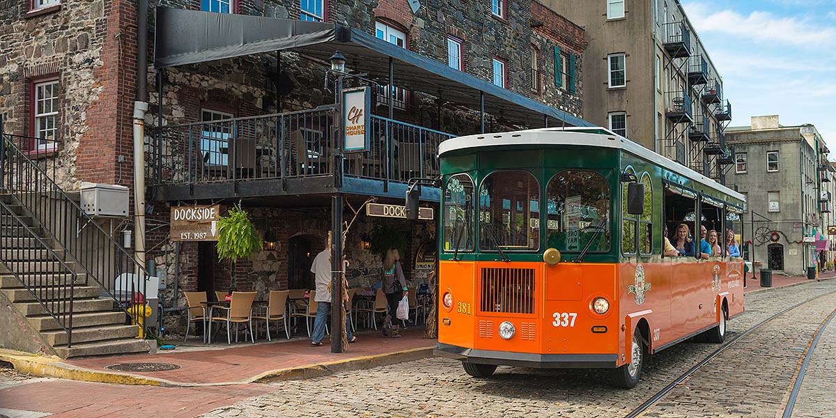 Savannah Old Town Trolley driving down River Street